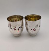 A pair of silver tea lights hallmarked 1987 inlaid with coloured flowers 142.8g Location: