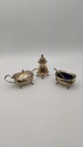 Three silver condiments to include a pepper pot, salts and mustard pot, hallmarked Birmingham