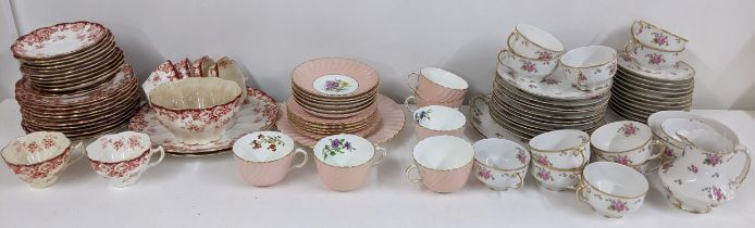 Three part tea sets to include an early 20th century Minton set, painted with flowers, signed F Fox,