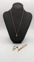 Mixed 9ct gold and yellow metal to include a 9ct gold pendant set with a green coloured stone on a