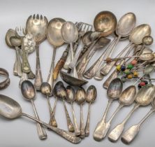 A quantity of various silver spoons to include four fiddle pattern shaped spoons and others, 241.