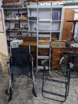 A DeVilbiss healthcare Drive folding wheelchair, a green tubular and plastic folding garden chair,