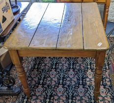A pine kitchen panelled tea dinning table on turned legs 73.5hx107w Location: