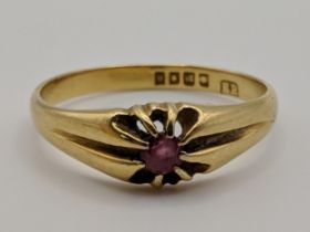 An 18ct gold ring set with a ruby 3.4g Location: