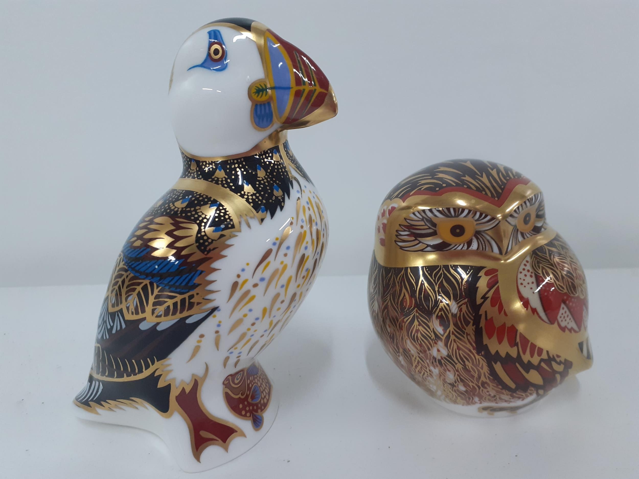 A Crown Derby Athena Owl with gold coloured stopper together with a Crown Derby model of a puffin