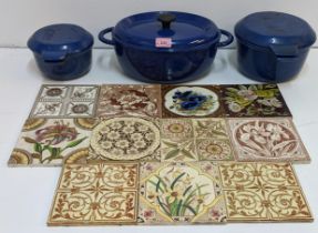 Three cast iron cooking pots and eleven pottery tiles of various designs Location: