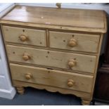 A pine chest of two short and two Tong drawers with bun shaped handles and turned legs95cm h x 89.
