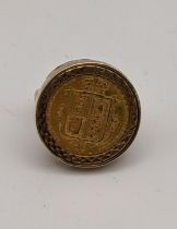 A 9ct gold ring set with a shield back half Sovereign 9.2g Location: