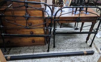 Victorian black painted cast iron single bedhead and footboard, and side irons Location: G