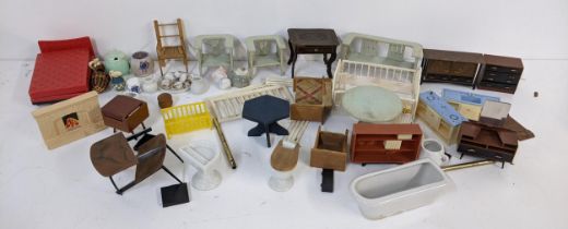 A selection of vintage dolls house furniture to include a tea set, dining table and others Location: