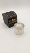 A silver napkin ring with case, 59g, hallmarked Sheffield 1909 Location: