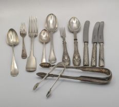 Mixed silver to include a pair of sugar tongs a fiddle pattern fork and other along with two