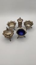 Five silver condiments to include a mustard pot and others, Birmingham 1905, total weight (excluding