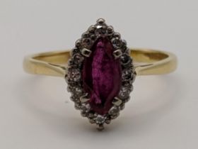 An 18ct gold ring set with a ruby and diamonds 4g Location:
