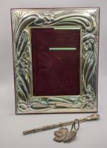 A silver embossed photo frame, a silver caddy spoon together with a silver yerba mate bombilla straw