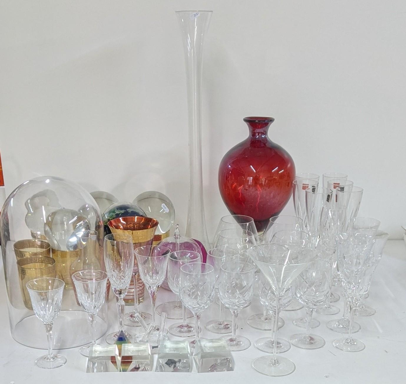 Mixed glassware to include various crystal cut drinking glasses, decorative glass balls, ruby