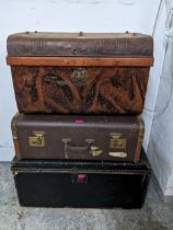 Vintage trunks to include a tin trunk, a wooden framed brown leather trunk and a black coloured
