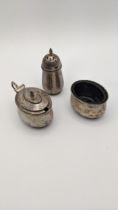Three silver condiments to include a pepper pot, hallmarked Birmingham 1940, total weight (excluding