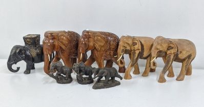 A group of treen elephants to include a pair having a floral carved design and others Location: