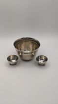 A Danish silver bowl with spot hammered decoration 102.4g, together with a pair of white metal salts