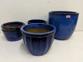 Four ceramic glazed blue garden pots, largest 31cm high Location: