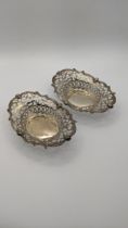 A pair of pierced silver pin dishes, hallmarked Birmingham 1905, total weight 78.1g Location: