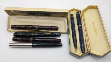 Six mixed pens to include a Conway Stewart fountain pen with 14k gold nib Location: