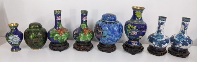 A collection of vintage Chinese cloisonne vases and a ginger jar decorated with flowers and Ruyi