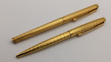 Two Parker Vendome basketweave pattern gold plated pens to include a fountain and a ballpoint pen