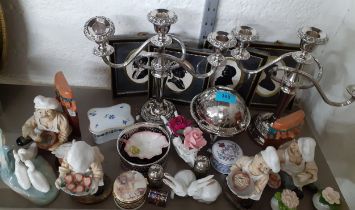 A mixed lot comprising silver plated items to include a pair of candelabras, resin ornaments,