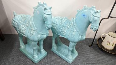 A pair of turquoise ceramic horse sculptures, 54cm h