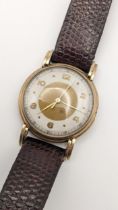 A mid 20th century 9ct gold gents 15 jewel manual wind wristwatch on a brown leather strap A/F