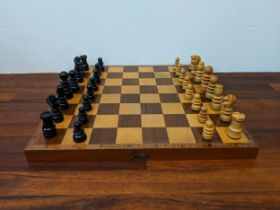 A wooden chess set with pieces, Location