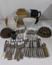 A mixed lot to include cutlery and flatware together with a pewter cup, Victorian jelly moulds, wall