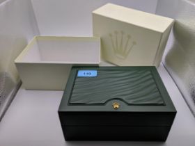 A Rolex green leather wristwatch box and out cardboard box, reference number 31.00.04 Location: