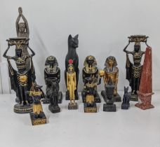 A mixed group of classical Egyptian Gods and Goddess figurines, together with an Egyptian cat