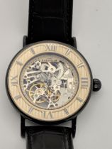 A Thomas Earnshaw gents automatic skeleton wrist watch, on a black leather strap Location: