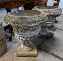 A pair of part painted composition stone garden urns, Location: