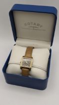 A ladies Rotary Revelation quartz 'Reverso' gold plated wristwatch, on a brown leather strap with