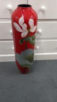 A modern tall floor standing vase on a red ground, decorated with flowers, 20-30, Location: