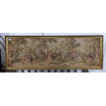 A Flemish machine woven tapestry depicting figures dancing, conversing and playing musical