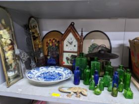 A miscellaneous lot to include glass poison bottles, American mantel clock, painted metal ornamental