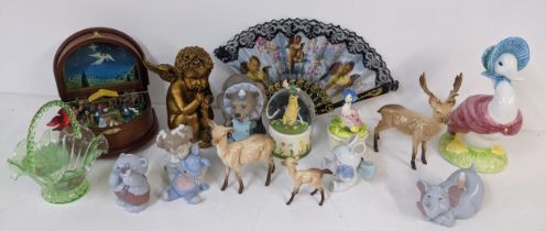 A mixed lot to include a Danbury Mint Nativity music box, Nao figures, Beswick deer, and others