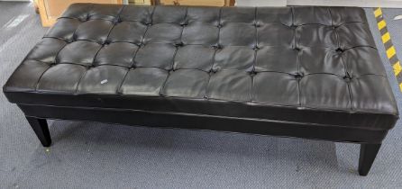 A modern black leather button upholstered large footstool, 41cm h x 153.5cm w Location: