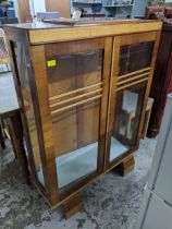 Art Deco walnut display cabinet twin glazed doors, glass internal shelves on shaped block feet