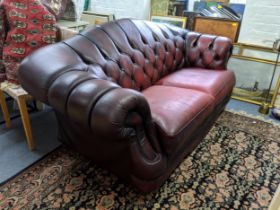 One Chesterfield red leather two-seater sofa Location: