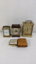 Three carriage clocks and a Smith Empire travel clock Location: