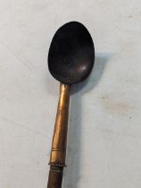 A copper ladle with a turned wooden handle Location:LWM