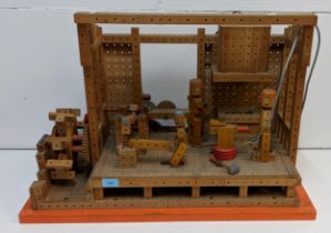 A self-made (possibly Mattel) woodworking/watermill workshop, with electrically-powered motor (