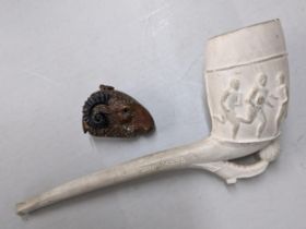 A 19th/20th century clay pipe with a football scene and rugby scene to the other side, and a